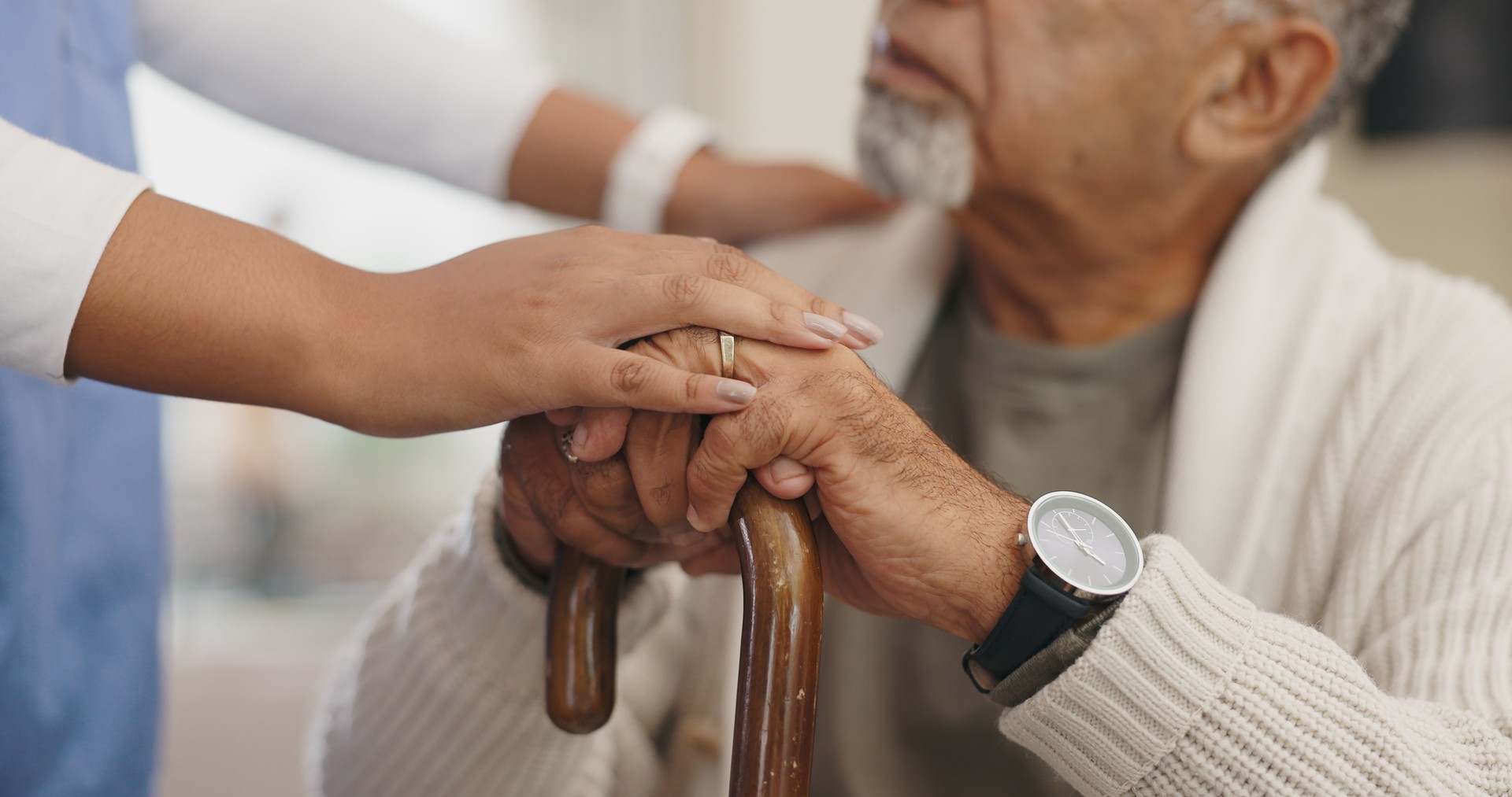 Senior care, support or hands of caregiver with person for healthcare service, wellness or empathy. Walking stick, disability and nurse helping for comfort or patient for medical check and nursing